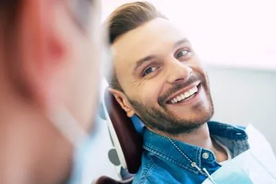 patient smiling during his visit to Moritis & Shin Dentistry in Seattle, WA