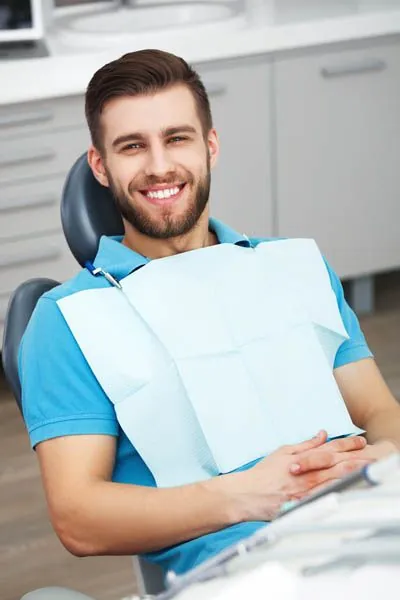 man smiling in the dental chair at Moritist & Shin Dentistry in Seattle, WA