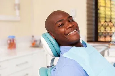 patient smiling during their dental appointment at Moritis & Shin Dentistry